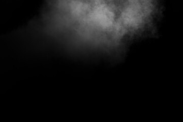Abstract white steam, smoke in the form of a cloud on a black background, copy space