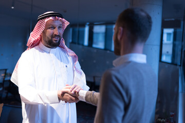 Arab Businessmen's Handshake with American Businessman Descent. Confirmation of Business alliance Partners as WELL. Adhering Respect, Commitment and Integrity in Business Partnership Deal