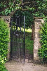 metal gate, metaphorical passage in the garden
