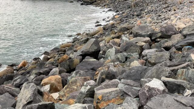 Rocky shoreline on the edge of the Atlantic Ocean Table Bay
