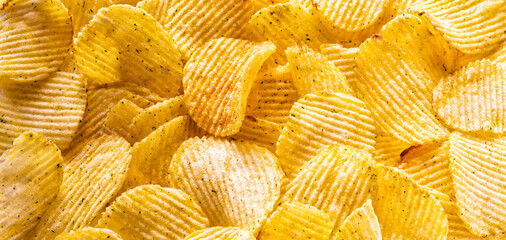 Pattern of potato chips, panorama, top view.
