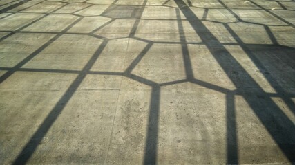 angular shaped shadows on the concrete