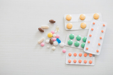 pills on white wooden table