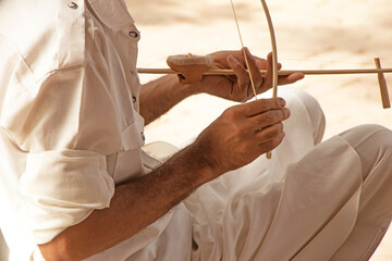 Man playing on musical Instrument  ektara