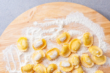 Italian pasta preparation, agnolotti with flour and eggs stuffed with meat, typical Italian food