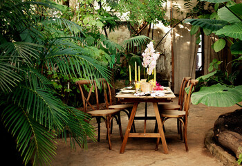 Table decorating for wedding or love story in botanical garden/greenhouse