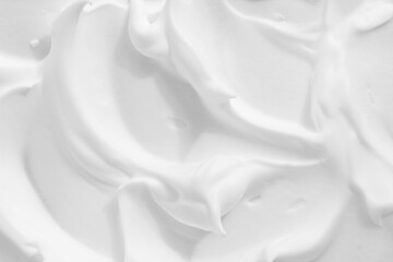 White cosmetic foam texture background. Thick mousse, cleanser, shaving foam, shampoo lather....