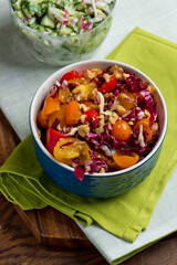 Radicchio tomato salad. Salad made with shredded purple radicchio, chopped cherry tomatoes, mandarin oranges, and tossed with olive oil and balsamic vinaigrette. 