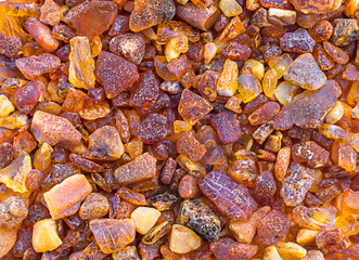 Amber stone background. Top view. Copy space.