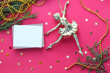 figurine of a ballerina girl on a Christmas tree. christmas card for ballerina greeting card design. flat lay. view from above