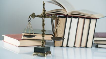 law concept with books and scales of justice.