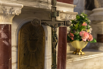 The bronze crucifix stands in the main hall of the Stella Maris Monastery which is located on Mount Carmel in Haifa city in northern Israel - obrazy, fototapety, plakaty