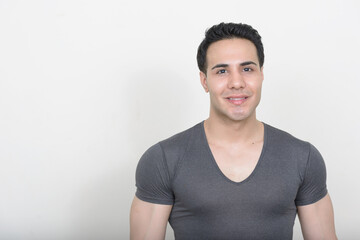 Obraz premium Portrait of young handsome man against white background