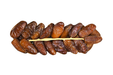 Dried dates isolated on a white background. A pile of dates with a plastic stick. Top view. Ripe,...