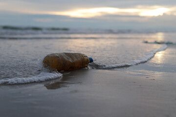 Plastic water bottles, garbage, pollution, left on the beach Environmental protection (Environmental concept Natural treatment)