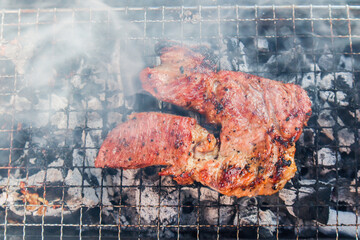 Roast pork on the grill