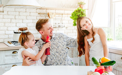 dad with daughters preparing pizza