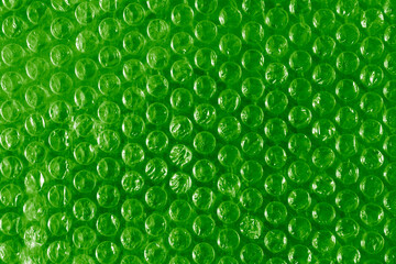 Bubble wrap packing on green background.  bubble wrap for packing orders.