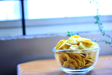 Banana chips in a glass bowl