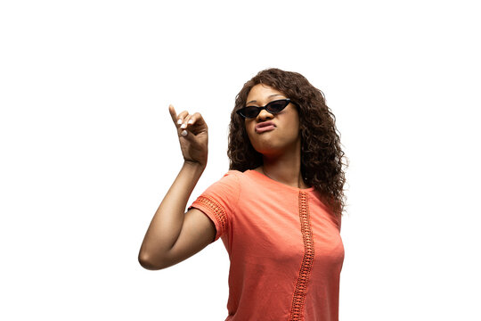 Salt bae. Young african-american woman with funny, unusual popular emotions and gestures on white studio background. Human emotions, facial expression, sales, ad concept. Trendy look inspired by memes