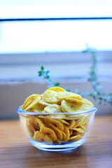 Banana chips in a glass bowl