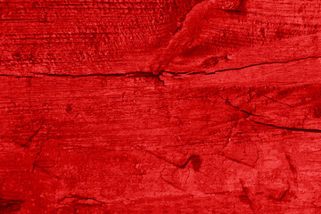 Vintage red wood background texture with knots and nail holes. Old painted wood wall 