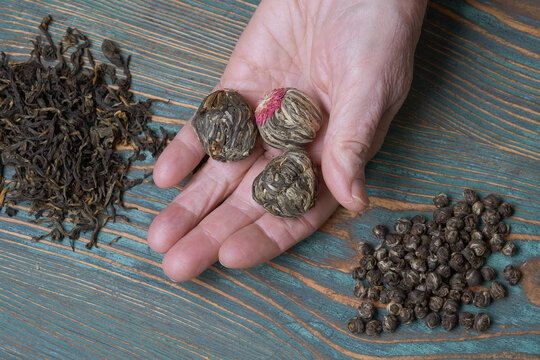 Hands Elderly Woman Holding A Handful Of Tea Leaves. 