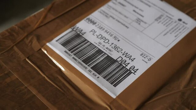 sticking the waybill paper to the cardboard box
