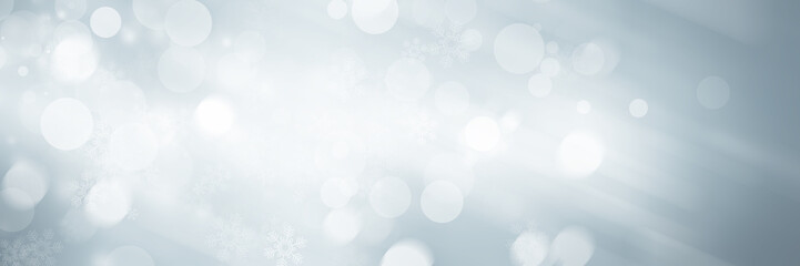 wide white and gray Christmas light with snowflake bokeh background, Winter backdrop wallpaper.