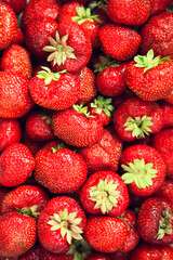Strawberry texture. Background with red strawberries. Berry pattern