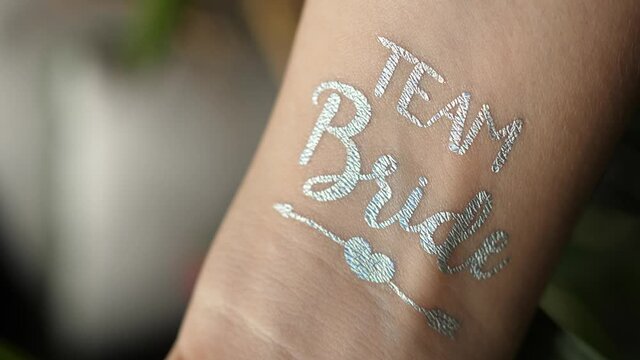 silver team bride stamp on wrist bachelorette party