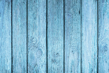Old peeling paint texture. Grunge cracked wooden wall background. Blue color weathered surface. Broken wood desk structure. Vintage board pattern design.