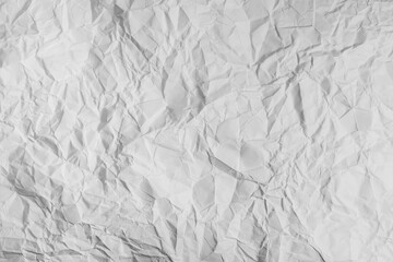 Fototapeta premium Crumpled white paper texture for background and copy text