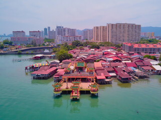 Fototapeta na wymiar The view from the drone on Penang jetties. Houses on the water. The island of Penang, Malaysia.