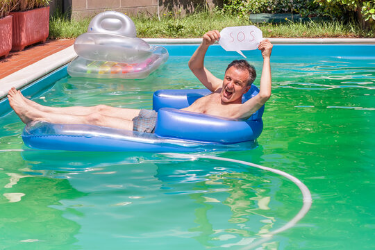 A white man on an inflatable mattress in a swimming pool holds the S.O.S. to ask for help