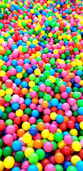 Fototapeta na wymiar Color balls. bright colors background, plastic balls in the kids playground