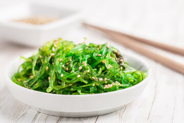 Traditional Japanese wakame salad with sesam seeds. Healthy seaweed salad.