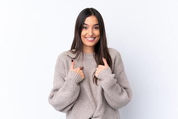 Young brunette woman over isolated white background with surprise facial expression