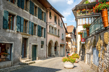 Small street and old colorful houses in the iconic village of Saint-Saphorin in Lavaux Vaud Switzerland - obrazy, fototapety, plakaty