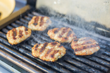 Grilling meat balls on grill