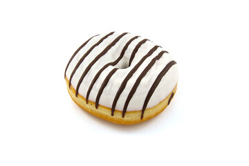 Isolated on a white background doughnut covered with white icing with black chocolate stripes