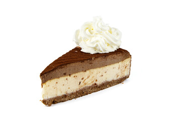Vanilla-chocolate layered cheesecake sprinkled with chocolate chips and decorated with whipped cream, on a white background