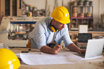 Carpenter working on a laptop