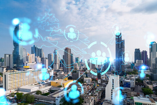 Social media icons hologram over panorama city view of Bangkok, Asia. The concept of people networking and connections. Double exposure.