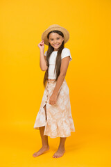 smiling cutie in straw hat. happy childhood concept. small girl has long healthy hair. kid beauty and fashion. she love summer holiday. its vacation time. feel happy and carefree