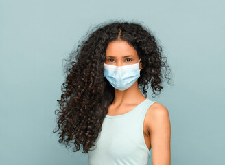 Young Afro American girl wearing a face mask