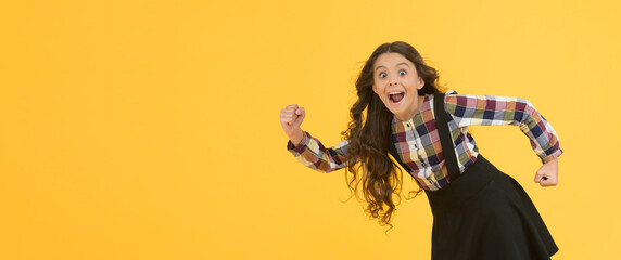 Obraz premium Tips for healthy hair. Towards the wind. Girl kid long hair flying in air. Growing hair. Natural beauty. Extremely effective product. Child with natural beautiful healthy hair yellow background