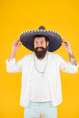 Ancestry language and cultural traditions. Discover ethnic and geographic origins. Bearded man in mexican hat. Mexican man wearing sombrero. Guy in wide brim hat. Ethnic concept. Ethnic background