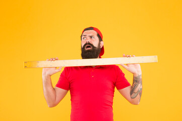 Size of parcel. Post office worker with ruler. Big size. Measuring tool. Man holding ruler on...