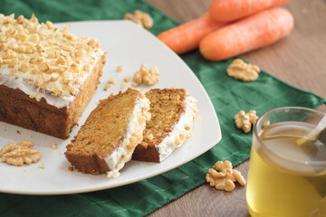 Sliced carrot cake ina white plate